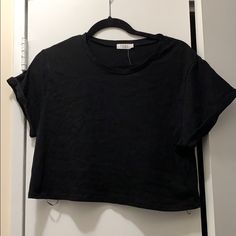 Black Cropped T-Shirt With Cuff Sleeves Black Cropped T-shirt With Crew Neck, Black Crew Neck Cropped T-shirt, Basic Black Cropped Cotton T-shirt, Black Casual Cropped T-shirt With Crew Neck, Black Everyday Tops With Shirttail Hem, Everyday Black Tops With Shirttail Hem, Black T-shirt With Shirttail Hem For Spring, Basic Black Cropped T-shirt For Spring, Black Casual T-shirt With Shirttail Hem