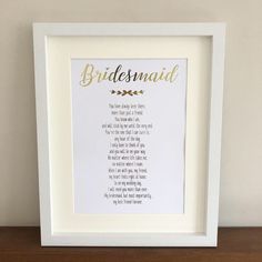 the bridesmaid poem framed in white with gold foil lettering on it's side