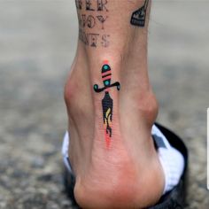 a person with a tattoo on their foot