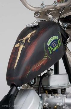 the back end of a motorcycle with an emblem on it