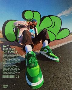 a man sitting on top of a skateboard next to a green shoe