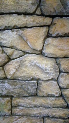 an image of a stone wall that looks like it is made out of rocks