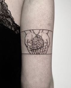 two hands holding each other on the left side of the arm with a black and white outline