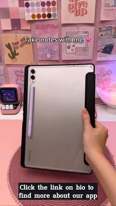 someone holding an ipad in front of a pink wall with pictures on it and the text, take notes with me click the link on bio to find more about our app