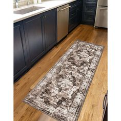 a large rug in the middle of a kitchen