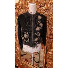 This sweater is so beautiful.  From the 50's by Miss Boutique. Knitted in Japan, decorated in Hong Kong, and sold in California. Quite the worldly sweater!  Made of super soft black lambs wool and angora. Lined in black silk.  The bottom of the sweater has a scalloped hem. Heavily beaded in gold and silver glass beads.  Very elaborate and totally glamourous!  Excellent condition.  Best fit would be a Large, however, please see the measurement below for a proper fit.  All sales are final. Measurements Armpit-armpit doubled 40" WAist 32" Length 20" Sleeve 20" Shoulder 16" Vintage Black Fitted Sweater, Black Embellished Cardigan For Party, Vintage Black Embellished Outerwear, Vintage Long Sleeve Cardigan For Evening, Embellished Evening Sweater For Winter, Elegant Embellished Black Cardigan, Vintage Winter Cardigan For Evening, Vintage Cardigan For Evening In Winter, Vintage Evening Cardigan For Winter