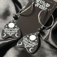 Gothic Witchy Moon and Moth Planchette hoop dangle earrings with black glass beads Charms are acrylic, beads are glass, Fishhooks & Components -  Stainless Steel, hypoallergenic, lead and nickel free. All jewelry sold by LD Nails // The Pretty Freaks is designed and handmade by me. Charms are purchased from jewelry supply shops, I am a nail artist not a metal smith :P I cut and bend my own wires, chains and components. Since I am not a machine there may be very slight variances in lengths.  Jewe Black Gothic Hoop Earrings Nickel Free, Gothic Black Hoop Earrings, Black Drop Earrings With Moon Charm, Black Dangle Hoop Earrings For Festivals, Black Halloween Festival Earrings, Black Earrings For Halloween Festival, Moth Planchette, White Gothic, Moon Moth