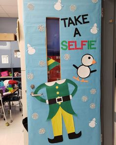 a classroom door decorated with an elf and penguin