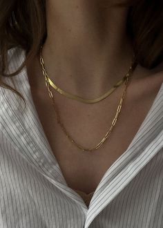 Includes one Carter Herringbone Chain Necklace and one Paperlink Chain Necklace.Jewelry pieces from The Stacked Collection pairings are not eligible for discounts and cannot be returned or exchanged individually. Carter Herringbone Chain Necklace 14k solid gold—always Average weight: 5.1g Width: 3mm Lobster clasp closure Herringbone Care: Please note that herringbone chains require careful handling. We recommend storing them on a flat surface when not wearing, making sure they don't get pushed against hard materials inside of a bag, etc. For travel, you can coil them and place them flat in a jewelry pouch.Paperclip Link Chain Necklace 14k solid gold—always. Average weight: 4.5g Width: 3mm Link measurements: 9mm x 3mm Links are semi hollow for a light and comfortable fit Lobster clasp closu Herringbone Chain Necklaces, Chain Necklace Outfit, Jewelry Stack, Necklace Stack, Casual Necklaces, Herringbone Chain, Herringbone Necklace, Average Weight, Link Chain Necklace