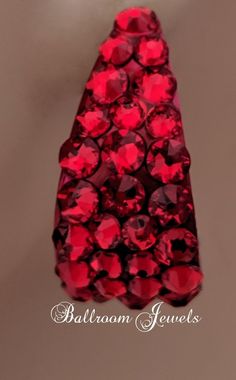 a red necklace with lots of diamonds on it