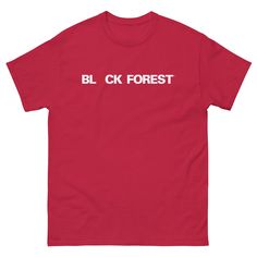 a red t - shirt with the word black forest printed on it in white letters