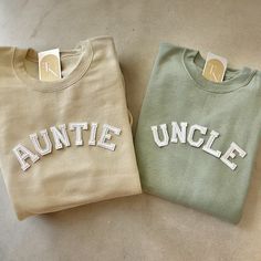 two sweaters with the word'anette uncle'printed on them sitting next to each other