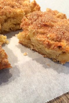 a piece of cake sitting on top of a white paper covered in crumbs