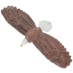 an eagle figurine is shown on a white background with the wings spread out