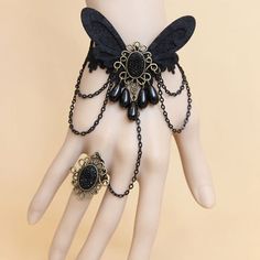 Include: Bracelet Product Code: LIN01266 Color: Black Gender: Female Materials: Lace,Bronze Alloy Accessories,Resin Drill,Iron Chain,Non-Woven Butterfly Notice: Other Accessories Are Not Inclued Length: 13cm Width: 2.1cm Style Types: Gothic Womens Trend: Fashion Retro One-Piece Chain With Ring Female Gothic Style Lace Bracelet. The Width Of The Lace Of The Bracelet Is About 2.1CM, The Length Of The Butterfly Is About 7CM, And The Width Is About 5CM. The Front Lace Part Of The Bracelet Is About 1 Bracelet With Ring, Hand Chain Jewelry, Gothic Lace, Gothic Bracelet, Lace Bracelet, Fabric Butterfly, Steampunk Accessories, Gothic Steampunk, Black Butterfly