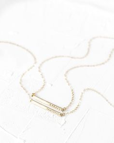 "This bar necklace is a classic, easy to gift piece. From the chain to the pendant, this style is made with 14k gold filled or sterling silver pieces, meaning it is built to last. Personalize this necklace with the names, dates, and special words that mean the most to you! 𝗘𝗮𝘀𝘆 𝗧𝗼 𝗦𝘁𝘆𝗹𝗲, 𝗠𝗮𝗱𝗲 𝗧𝗼 𝗟𝗮𝘀𝘁 Our dainty bar necklaces make for the perfect everyday piece, personalized with your most special sentiments, moments, and memories! Created to last a lifetime, these necklaces Minimalist Gold Nameplate Bar Necklace, Gold Bar Necklace With Rectangular Pendant For Everyday, Minimalist 14k Gold Filled Bar Necklace For Gift, Minimalist 14k Gold Filled Bar Necklace Gift, Everyday 14k Gold Bar Necklace With Adjustable Chain, Classic Gold Bar Necklace For Everyday, Gold Minimalist Bar Necklace, Minimalist Gold Name Necklace For Best Friend Gift, Minimalist Gold Name Necklace For Best Friend