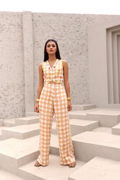 Edgy and easy-going, our block printed two piece co-ord set is a wardrobe staple you can’t miss out on.Hand block printed in Jaipur, Rajasthan.Made in soft modal cotton satin.Cropped waistcoat features a boxy silhouette and V neckline. The waistcoat is adorned with crocheted flowers and gold beads.Pants feature an elasticated back waist and front zipper. Highlighted with front hip pockets.Styling Tip- Style it with a tote bag and statement jewellery to ace that look. soft modal Cottonsatin 1 ski Cropped Waistcoat, Half Jacket, Shirt Jacket Men, Crocheted Flowers, Coord Set, Drape Saree, Statement Jewellery, Jaipur Rajasthan, Silk Roses