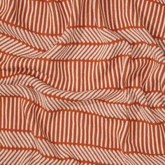 an orange and white striped fabric