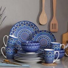 a blue and white dinnerware set on a table