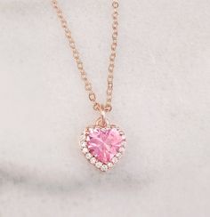 "This heart initial necklace is made with your choice of a 10mm Pink, Aqua Blue or Olive Green and clear cubic zirconia heart which hangs on an 18-inch rose gold-plated cable chain. Just pick your heart crystal color in the drop down menu. Thank you for looking. NOTE: This listing is for one necklace with one pendant, but you can choose to purchase just the pendant without the chain (see drop down menu). The \"Pendant Only\" option includes the pendant with a bail/top loop and no chain. The beau Rose Gold Heart Beads Pendant Necklace, Pink Heart Charm Necklace In Cubic Zirconia, Pink Clavicle Chain Necklaces For Anniversary, Rose Gold Heart Beaded Pendant Necklace, Pink Heart Beads Necklace For Anniversary, Pink Cubic Zirconia Heart Charm Necklace, Pink Clavicle Chain Jewelry For Anniversary, Rose Gold Heart Pendant Necklace With Beads, Pink Clavicle Chain Necklace For Anniversary