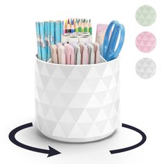 a pen holder with pens, pencils and markers in it on a white background