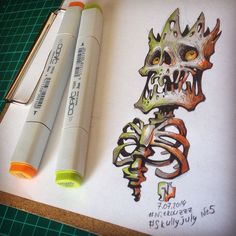 a drawing of a skeleton on paper with marker pens next to it and an eraser