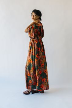 Unleash your inner flower child with The Renlund V-Neck Pleated Midi Dress! Made with a gorgeous brown floral pattern, this dress features a playful v-neck and flattering pleats. Perfect for any occasion, it's sure to make a statement without taking itself too seriously. Details self: 100% polyester lining: 97% polyester + 3% spandex Fabric Care Guide Here Sizing & Fit Measurements are approximate and taken while laying flat across the front. Not doubled. small: bust = 24"; waist = 14"; length = Brown V-neck Dress For Garden Party, Brown Floral Print V-neck Dress, Bohemian V-neck Maxi Dress With Elastic Waistband, Brown Floral Print Maxi Dress For Garden Party, Brown Floral Print V-neck Maxi Dress, Brown V-neck Maxi Dress With Floral Print, Textured Sweater, Detailed Sweater, Pleated Midi Dress