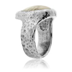 Sterling Silver Hammered Simple Elk Ivory Ring Immerse yourself in the rugged charm of our Sterling Silver Hammered Simple Elk Ivory Ring, a symbol of the raw beauty of nature and your hunting triumphs. This distinctive piece tells a story of adrenaline-filled adventures, of solitary moments in the wilderness, and of personal achievement. Each elk ivory is meticulously fitted into its unique setting by our master goldsmiths, mirroring the extraordinary precision and patience required in your hun Elk Ivory Mens Ring, Elk Ivory Ring, Elk Ivory, Ivory Ring, Tooth Ring, Aquamarine Studs, Interlocking Ring, Antler Ring, Elk Antlers