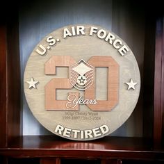 the u s air force celebrates its 20th anniversary with a commemorative plaque in front of it