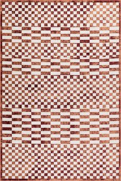 a brown and white rug with squares on it