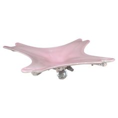 a pink flower shaped glass drawer pull