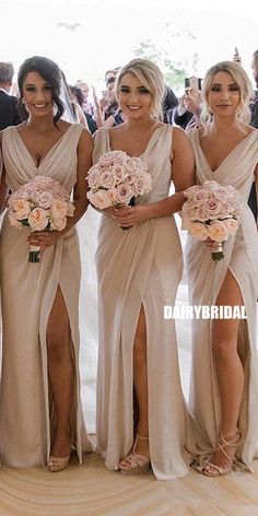 the bridesmaids are all wearing different dresses