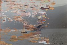 a sailboat floating on top of a large body of water covered in colorful flags