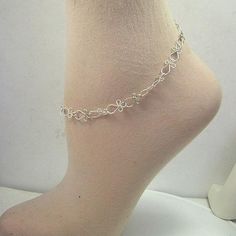 Gorgeous, lacy handcrafted links that look like little ankhs (or angels if you turn them upside-down!) Made with sterling silver wire. This unique anklet closes with a sturdy sterling silver spring ring. A sweet, feminine gift for graduation or a special birthday. Choose your custom variation for a perfect, comfortable fit! Silver Spiritual Anklets As Gift, Delicate Adjustable Silver Anklets, Handmade Spiritual Anklets As Gift, Spiritual Handmade Anklets As Gift, White Metal Anklet Perfect For Gifting, Dainty Handmade Adjustable Anklets, White Metal Anklet As Gift, Handmade Dainty Adjustable Anklets, Handmade Silver Anklets As A Gift