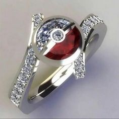 a red and white diamond ring on top of a silver band with diamonds around it