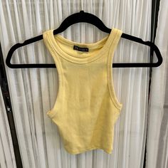 Pale Yellow Halter Tank From Zara! Never Worn. Very Stretchy Cotton Material. Zara Fitted Tank Top For Spring, Zara Cropped Tank Top For Spring, Basic Zara Crop Top For Summer, Cheap Yellow Tank Tops, Cheap Yellow Zara Top, Zara Yellow Party Top, Cheap Yellow Tank Crop Top, Yellow Cotton Crop Top Tank, Yellow Tank