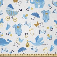 a blue and white fabric with baby items on it