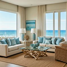 a living room filled with furniture next to a window covered in blue and white pillows