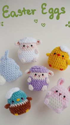 small crocheted easter eggs sitting on top of a white table next to each other