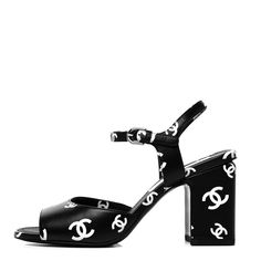 Chanel Lambskin Printed CC Sandals Heels Shoes 22S Black/White Size 40 NEW. This is an authentic pair of CHANEL Lambskin Printed CC Sandals size 40 in Black and White. These stylish sandals are crafted of black calfskin leather. The sandals feature a Chanel CC logo design in white, and a 3.5-inch block heel. Comes with 2 chanel bags only, no box. Sorry, no returns. All sales final. Please know your size. Black And White Chanel Bag, High-end Open Toe Summer Sandals, High-end Open Toe Sandals For Summer, High-end Open Toe Heels With Branded Heel Counter, Designer Sandals With Branded Heel Counter And Block Heel, Designer Open Toe Heels With Contrasting Heel Counter, Designer Block Heels With Contrasting Heel Counter, Cc Logo Design, White Chanel Bag