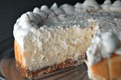 a close up of a cake with white frosting