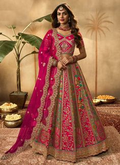 Rani Pink banarasi silk bridal lehenga choli 10275Desc:  Style : Circular Lehenga Choli Color : Rani Pink Fabric : Banarasi silk  Work : zari weaving and and Embroidery Wash Care : Dry clean Sleeve Style : Half Sleeve Long Sleeves : Done only in Custom Stitch Sleeves Lining : Done only in Custom Stitch Bust Size : 32 to 42 Inches Occasion : Wedding   Mehendi   Engagement   Reception   Ceremonial   Baby Shower   Party WearSemi stitch lehenga choli.Size till 42 inch.silk lehenga choli . With Express Free Shipping and Custom Stitching, Buy Lehenga - Indian Party wedding and bridal  Rani Pink banarasi silk bridal lehenga choli 10275 online in USA, UK and Canada from KollyBollyEthnics.com Silk Bridal Lehenga, South Indian Women, India Outfits, Pattu Langa, Bridal Lehenga Online, Indian Dresses Online, Ghaghra Choli, Designer Bridal Lehenga Choli, Indian Wedding Sarees