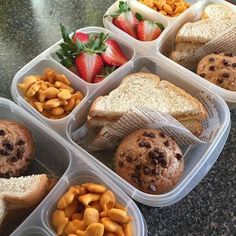 six plastic containers filled with different types of food and fruit on top of a table