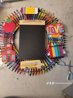 an art project made out of crayons and colored pencils