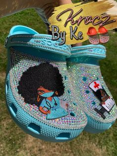 Beautiful simple crocs for a beautiful black nurse! *the crocs will not be the same color as the patch* Nurse Bling Crocs, Crocs Scrubs, Custom Crocs Diy, Custom Nurse Crocs, Nurse Crocs, Black Customized Crocs, Nurse Croc Charms, Nursing Crocs, Bedazzled Shoes Diy