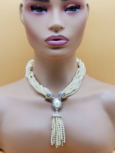 In beautiful vintage condition.  Clearly stamped Vb. Gold tone metal with sparkly clear stones and 10 strands of faux Pearls. Very classy looking, very well made. The strands can be twisted when the necklace is open to make it a little shorter/ longer. Please look at the pictures for details and condition or message me with any questions Evening Multi-strand Pearl Necklace, Multi-strand Pearl Necklace For Party, Costume Multi-strand Pearl Necklace For Party, Evening Beaded Pearl Necklace In Costume Jewelry Style, Beaded Pearl Necklace For Evening In Costume Jewelry Style, Evening Beaded Costume Pearl Necklace, Beaded Costume Pearl Necklace For Evening, Multi-strand Pearl Necklace For Formal Occasions, Formal Costume Multi-strand Pearl Necklace