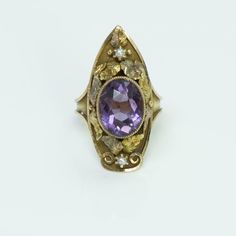 Antique Amethyst Pearl Gold Ring. 14K yellow gold ring with amethyst and two pearls. Leaves in yellow and rose gold. Gemstone Appraisal Report: Amethyst weight 3.50 Carats. Size: 7.25. Weight: 5.1 Grams. Heirloom Multi-stone Amethyst Ring, Purple Amethyst Ring With Rose Cut Diamonds, Heirloom Multi-stone Purple Amethyst Ring, Vintage 14k Gold Multi-stone Amethyst Ring, Vintage Multi-stone Amethyst Ring In 14k Gold, Antique Gold Amethyst Multi-stone Ring, Antique Gold Amethyst Ring With Multi-stone, Heirloom Multi-stone Amethyst Ring In 14k Gold, Pearl Gold Ring