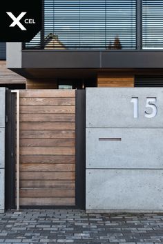 an entrance to a modern house with wooden slats