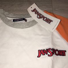 Brand New, With The Original Tag Still, Never Been Used. Color - White, Grey, Orange, Front Embroidered Logo - Red. Back Big Logo - Black. Material - 95% Cotton 5% Elastane Casual White Tops With Embroidered Logo, White Embroidered Logo Top For College, White Sports Top With Embroidered Logo, White Sports Tops With Embroidered Logo, White Tops With Embroidered Logo For Sports, White Varsity Top For Spring, College Mom, Navy Blue T Shirt, University Tees