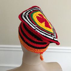 These African traditional hats is part of the Cameroonian national Outfit. For example, These kind of hat is worn by the Cameroonian team at the opening ceremonies of the Olympics ( see pic 4) Description: - Hand woven crochet hat - Unisex - Pom pom on the back - 100% cotton - Origin: Cameroon As seen in picture 3, design at the top of the hat will differ from one hat to another.At the bottom, some hats are red/black and other are white/blackSize: These hats should fit most. Threads stretch to f Adjustable Traditional Headwrap, Traditional Handmade Crochet Cap, Traditional Handmade Crochet Cap Hat, Handmade Traditional Crochet Cap, Handmade Adjustable Traditional Crochet Hat, Traditional Red Brimmed Hat, Traditional Red Headwrap, Traditional Brimmed Red Hat, Traditional Red Hat One Size Fits Most